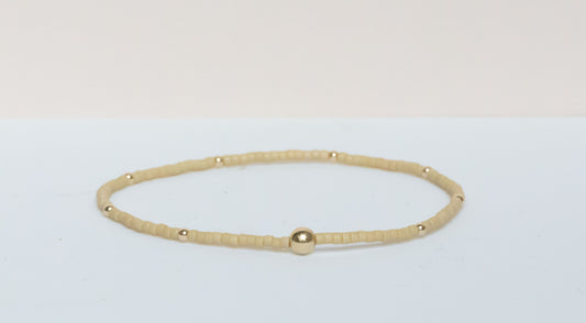 The Natural Glam Matte Khaki Bracelet from the hope bead co. Japanese glass and 14-karat gold filled beads on stretch bracelet.