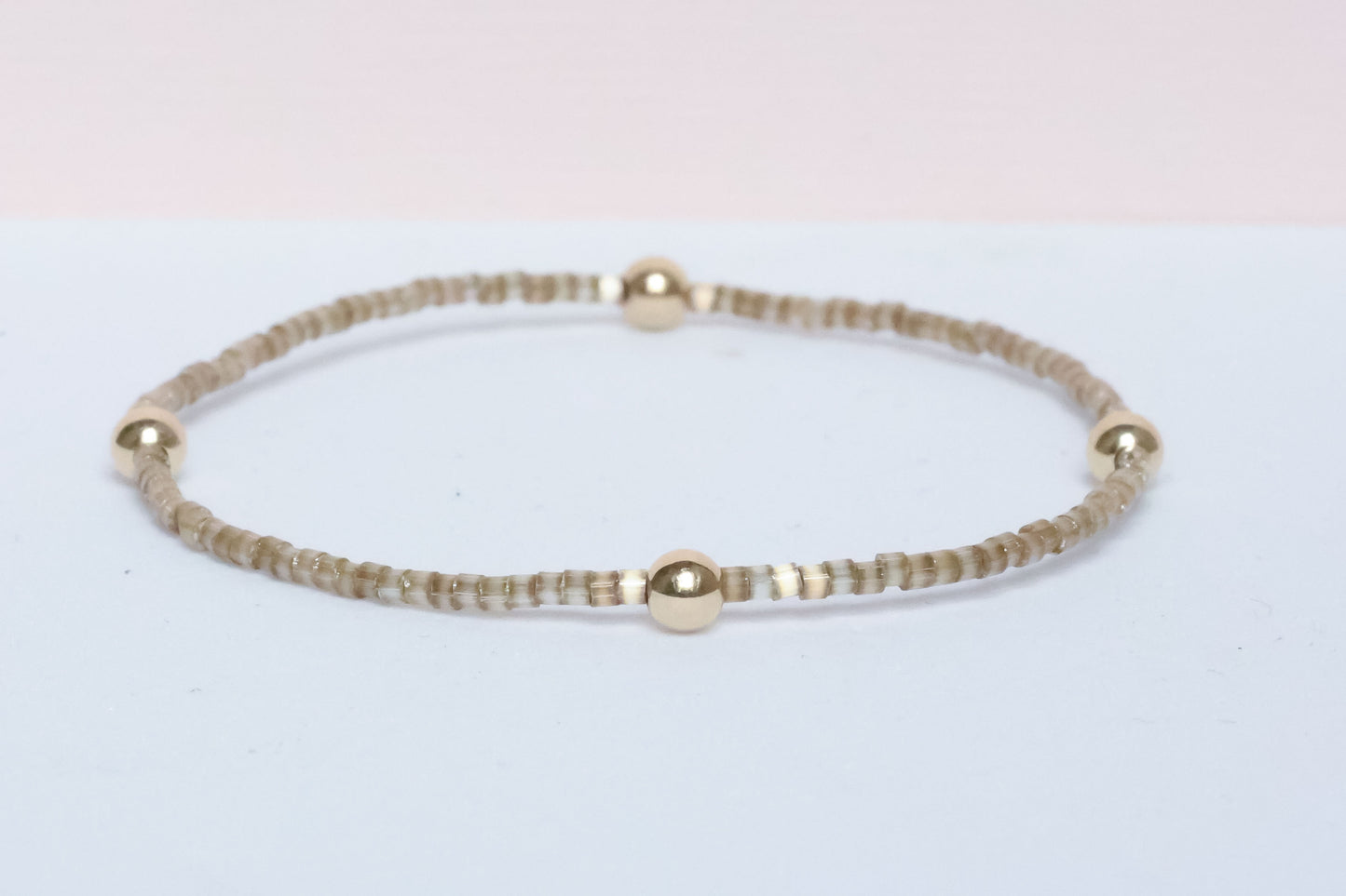 The Natural Glam Tortoise Bracelet from the hope bead co. Japanese glass and 14-karat gold filled beads on stretch bracelet.