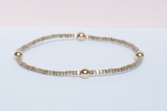 The Natural Glam Tortoise Bracelet from the hope bead co. Japanese glass and 14-karat gold filled beads on stretch bracelet.